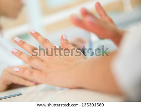 Woman getting her nails done at the beauty salon