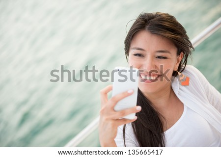Summer woman on boat taking a picture
