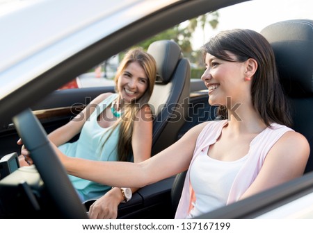 Women on a road trip talking and looking very happy