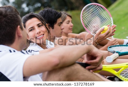 Group of tennis players taking at the court