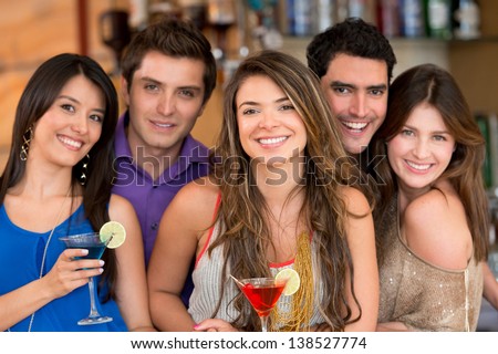 Group Of Friends At The Bar Having Drinks