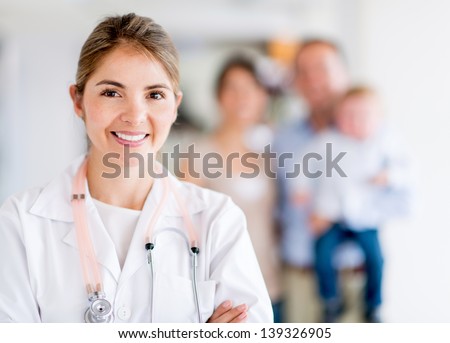 Happy family doctor at the hospital looking happy