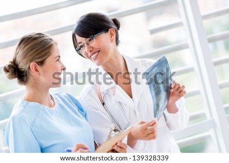 Medical staff at the hospital talking about an x-ray