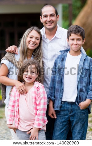 Beautiful casual family looking very happy outdoors