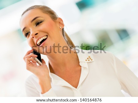 Business woman making a call on her cell phone