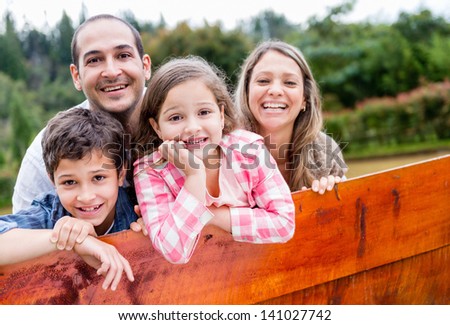 Happy Family Enjoying Their Time Together In The Countryside