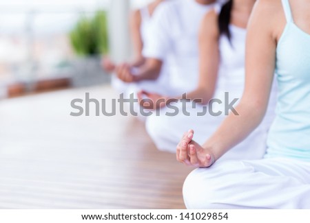 Group of people relaxing and doing yoga