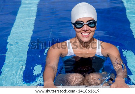 Professional female swimmer training in a swimming pool
