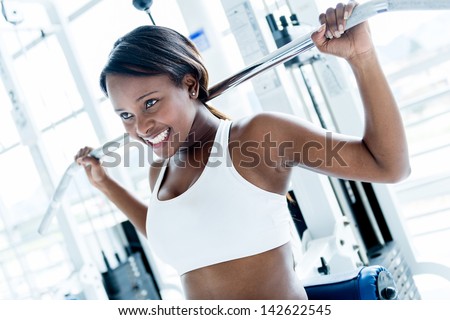 Woman at the gym working out on a machine