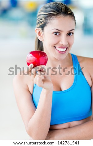 Healthy eating woman holding an apple and dieting