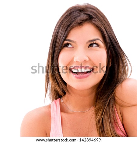 Pensive woman smiling - isolated over a white background