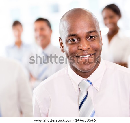 Happy black business man at the office smiling