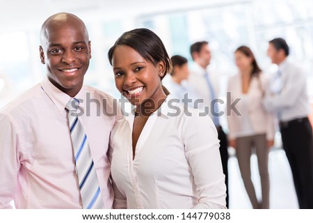 Black Business Couple Looking Happy At The Office