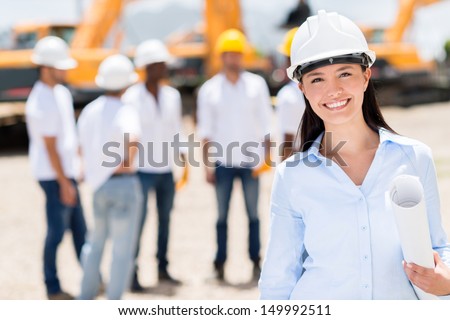 Female Architect At A Construction Site Looking Happy