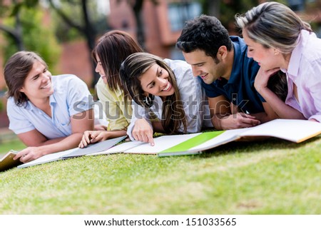 Group Of Friends Studying Outdoors At The Park