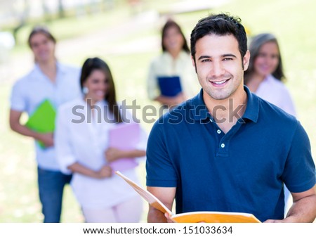 Male student  at the university campus looking very happy