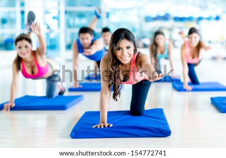Group Of People At The Gym In A Stretching Class
