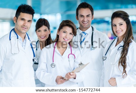 Group of friendly doctors working together and smiling