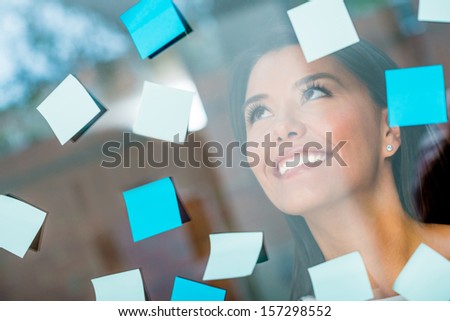 Woman Multitasking With Posting Post-Its All Over The Place