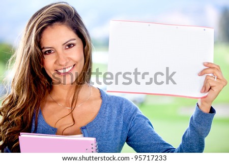 Female student holding a piece of paper to write something