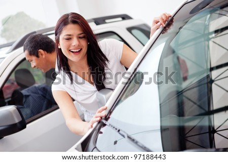 Couple at the dealer looking for a car