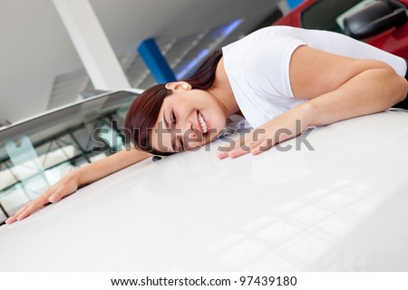 Woman at the dealer looking for a new car to buy