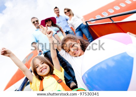 Happy kids traveling by airplane for their vacations Happy kids traveling by airplane for their vacations