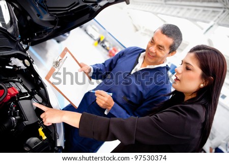 Woman taking car to the garage for mechanical checkup