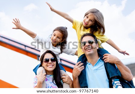 Happy family wth two kids traveling by airplane