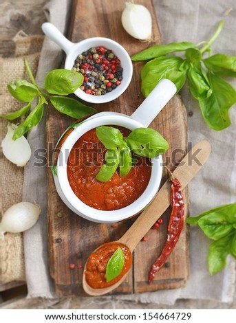 Traditional homemade tomato sauce with empty name tag and ingredients