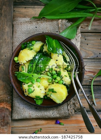 potatoes ,ramson and green pea spring salad in the dish