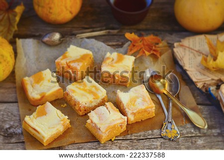 pumpkin pie about cream cheese on an autumn background.selective focus