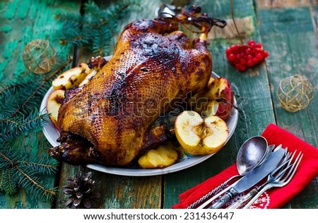 the Christmas baked goose with apples. vintage style. selective focus