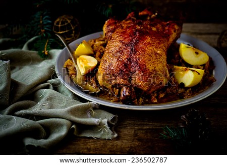 the duck baked with sauerkraut. traditional Russian and Ukrainian New Year\'s dish. selective focus. vintage style.