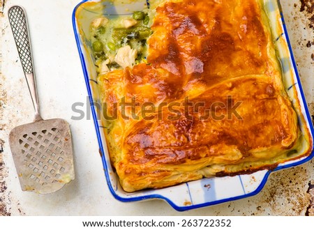 Puff pastry pie with chicken and vegetables. top view. selective focus. style vintage