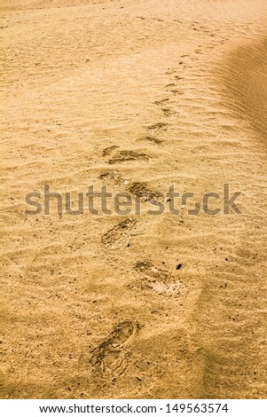 Traces of the shoe on a sand dune in the desert