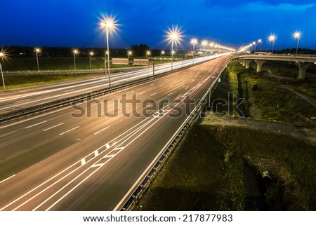 headlights racing machines.The ring road interchange in St. Petersburg at evening illumination