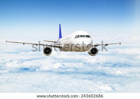 A passenger plane flying above the clouds in the sky at a height of ten thousand feet