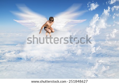 boy with Angel Wings flying around in the sky above the clouds