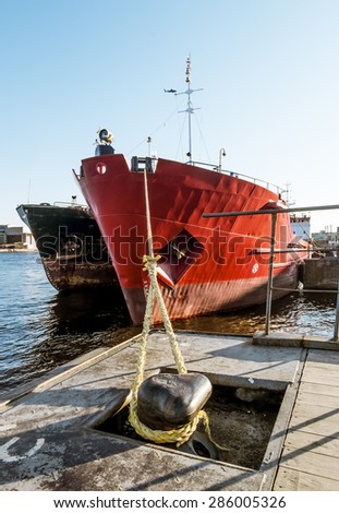 Dry cargo ships docked at Quay Lieutenant Schmidt in St. Petersburg