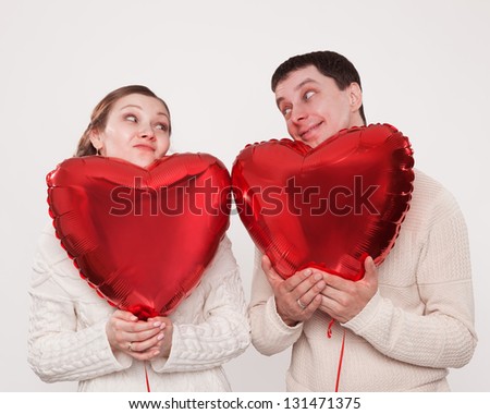 The girl and the guy with balloons in the form of heart