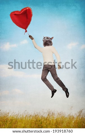 Cat people flying holding a balloon in the shape of heart outdoors