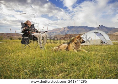Girl with a dog in the tourism campaign on vacation