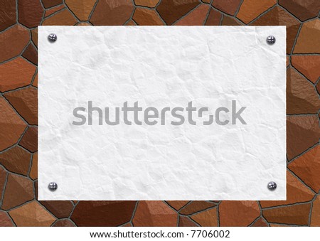 Place for announcements on a stone wall.