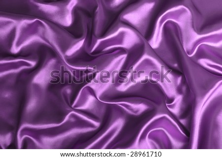 Close-up of purple satin sheets.