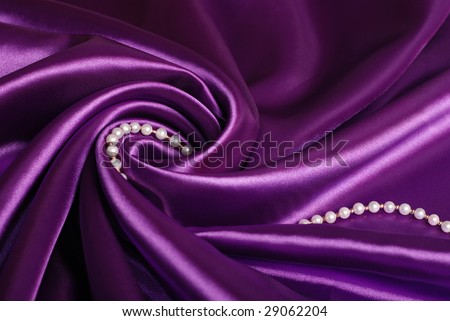 pearl necklace on purple satin