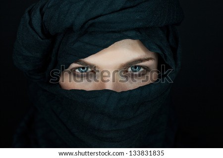 eyes of a beautiful man with black scarf