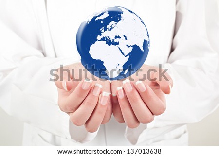 doctor woman holding globe on her hands