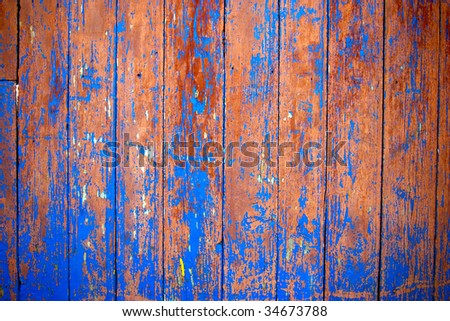 Dirty, stained by a paint the hammered together fence