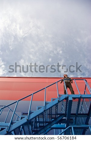 a man running up the stairs on the background of the building